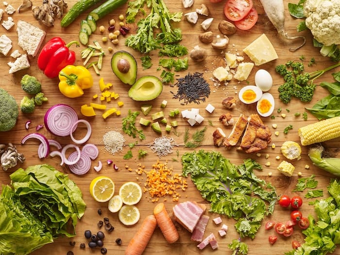 Sliced ingredients on a wooden platform