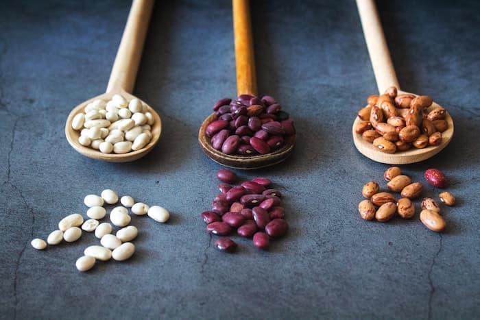 beans on wooden spoons