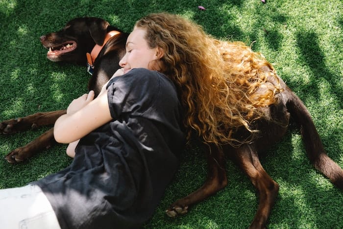 dog and owner in shade