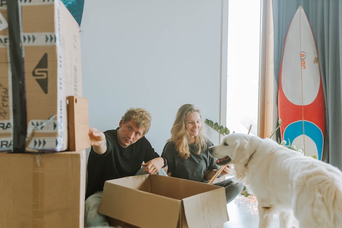 A couple preparing for relocation with their pet