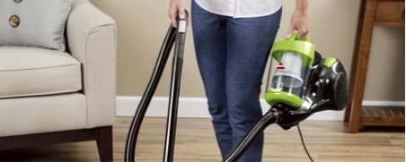 woman with a vacuum in hand