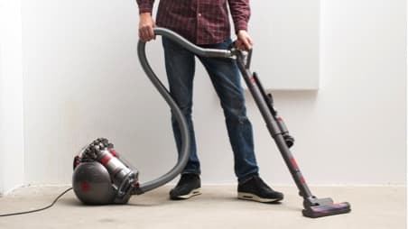 vacuuming the carpet