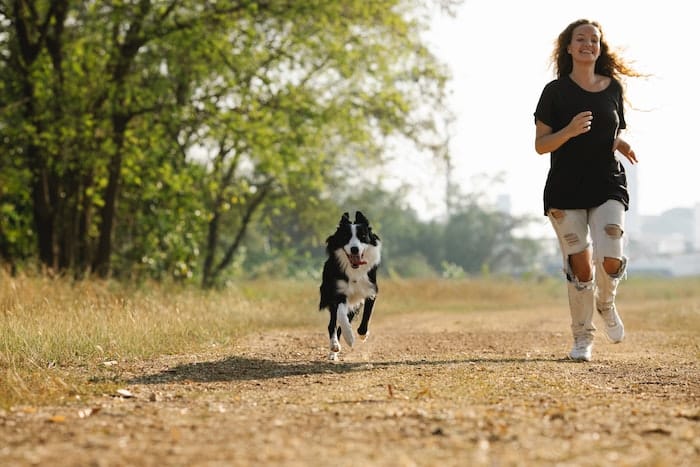 woman running with dog